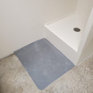 Non slip surface coating for a shower