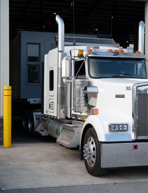 portable jail cell moving on a truck