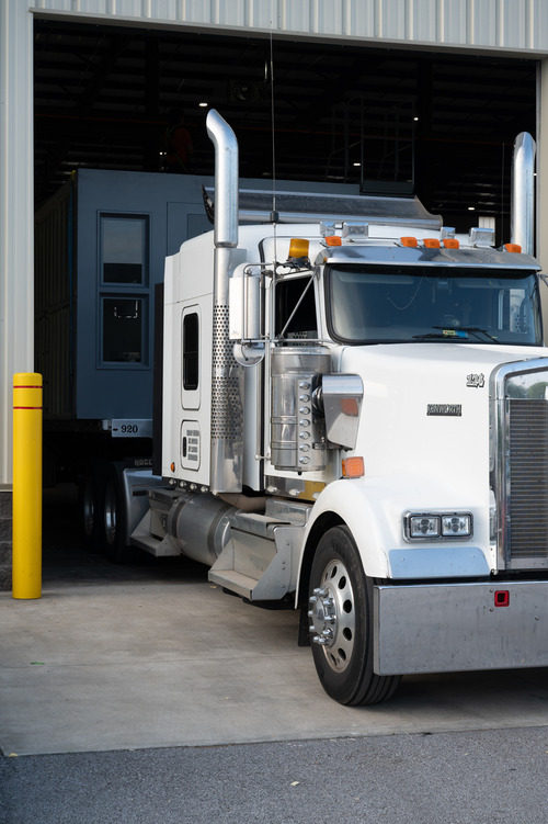 portable jail cell moving on a truck
